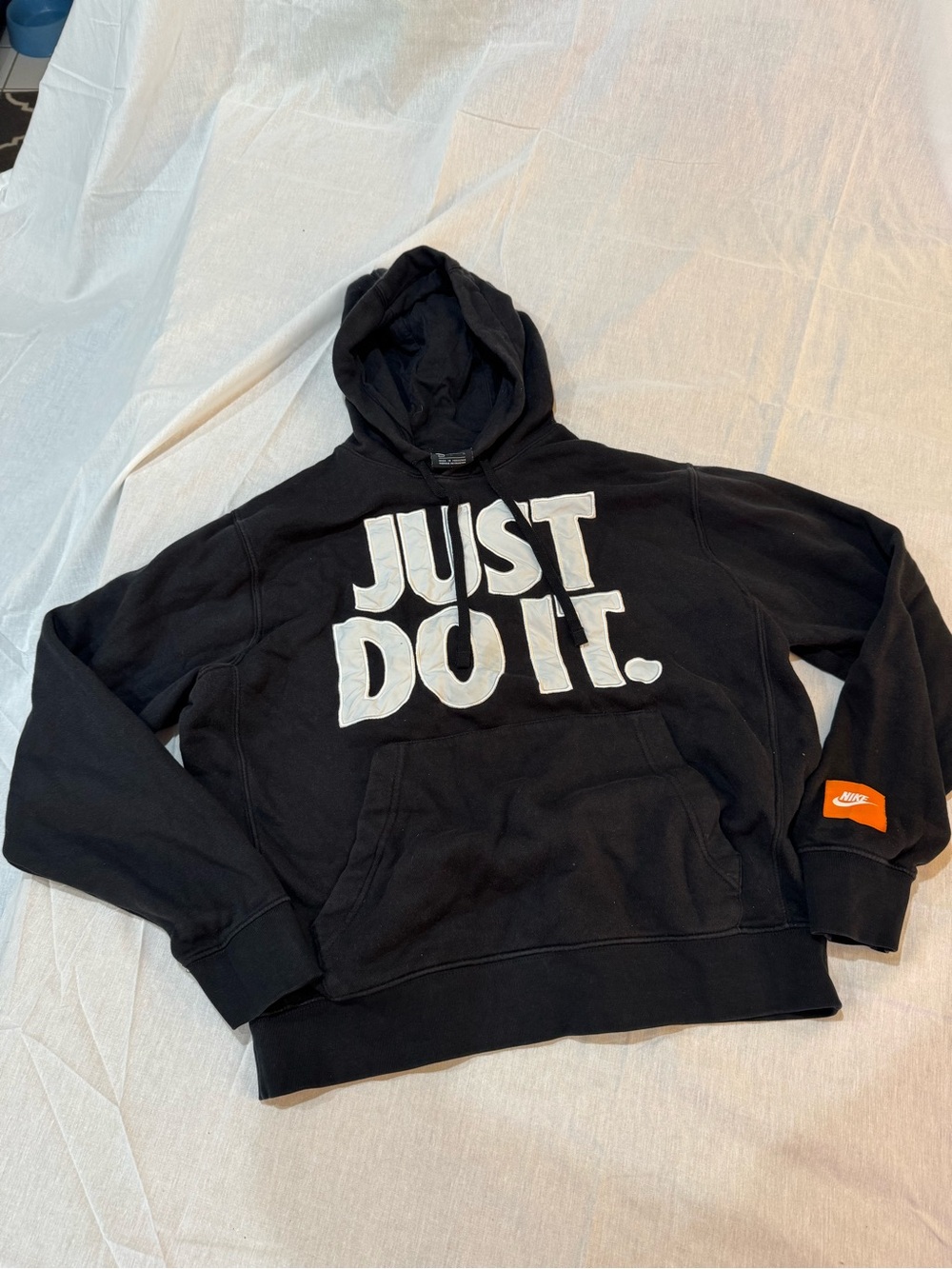 Nike black hoodie with white 'JUST DO IT.' text, size M